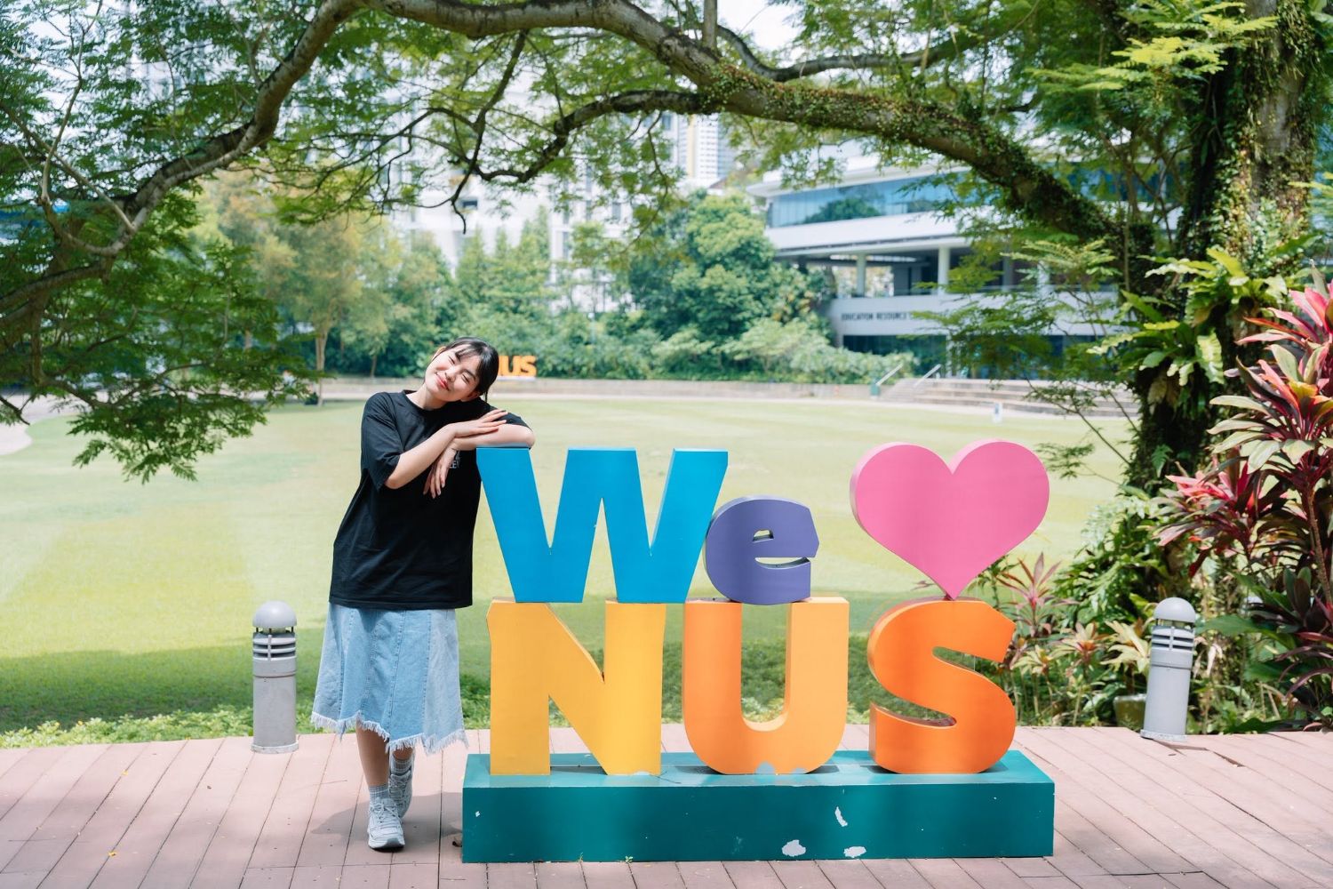 Trang Do at the We Love NUS sign